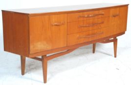 A vintage retro 20th Century teak wood sideboard - credenza of Danish design. The sideboard having a