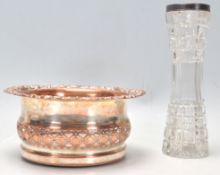 A late 19th / early 20th Century silverplate on copper wine coaster having pierced decoration and