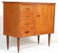 A mid century retro, circa 1970's teak wood sewing table cabinet – desk combination having fold