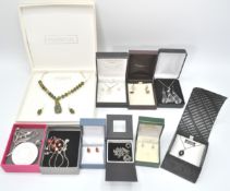 A collection of boxed silver jewellery to include roundel pendant and chani, facet cut glass pendant