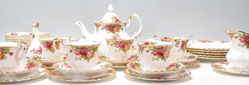 A Royal Albert bone china tea service in the Old Country Roses pattern to include a teapot, dinner