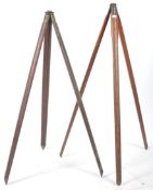An early 20th century wooden and cast metal surveyors tripod stand.The tapering wooden  legs