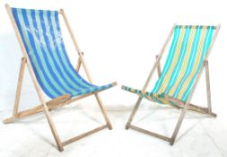 A pair of vintage retro wooden framed folding deck chairs together with a set of three vintage