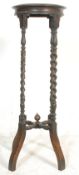 A 19th Century Victorian oak plant stand / jardiniere / torchere. The stand having a round top
