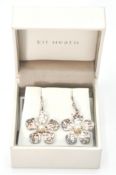 A pair of Kit Heath original modernist sterling silver earrings. The earrings with flower head