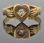 A Victorian 19th century 15ct / 625 hallmarked gold and diamond Irish claddagh ring. The ring with