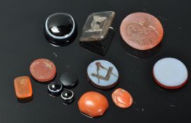 A group of antique intaglios fob stones / seals to include Carnelian example, coral, bulls eye