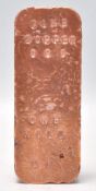 A copper bullion bar inscribed with 
