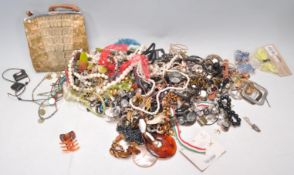 A collection of vintage costume jewellery to include a wide selection of beaded necklaces, a vintage