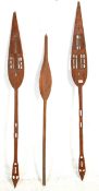A group of three Cameroonian / Duala paddles with carved and pierced decoration. Measures 159cm.
