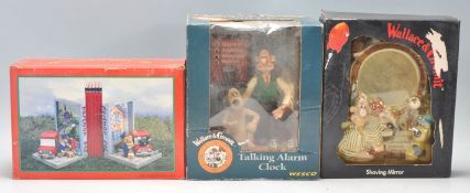 Two vintage Wallace and Gromit collectables to include a talking alarm clock and a novelty Shaving