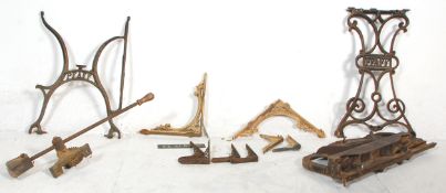 A good mix of Victorian and early 20th century wrought and cast iron wares to include pairs shelf