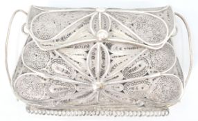 A good continental silver ladies purse having a decorative filigree body with hinged opening top.