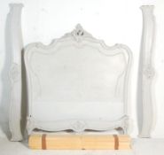 A French antique Louis XV style painted walnut double corbeille bed. The shaped headboard with a