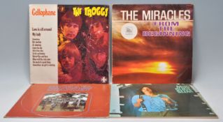 A mixed group of four vinyl long play LP record album to include The Troggs – Cellophane –