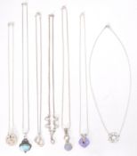 A collection of silver necklace chains to include pendants to each. Fine linked with stone set, fine