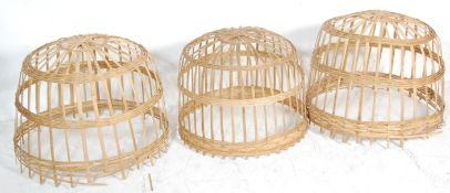 A group of three 20th Century graduating Asiatic unusual Malaysian cock fighting baskets constructed