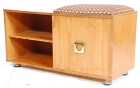 A nice retro mid 20th Century teak wood telephone table / unit having a padded top to the right.