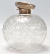 An antique early 20th Century art nouveau etched glass perfume bottle with a hallmarked sterling