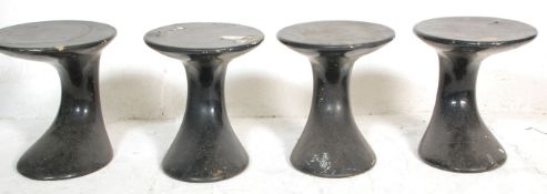 A set of four vintage retro stools Tulip style side tables of round form having black paintwork