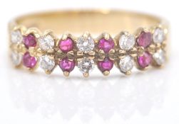 A 9ct gold red and white 18 stone ring. The ring w