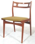 A stunning mid 20th Century retro teak framed dining chair raised on splayed tapering legs with a