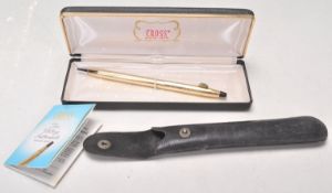 A group of vintage writing pens to include a rolled gold Cross ball point pen, a Pentel Rolling