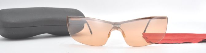 A cased pair of Chanel designer sunglasses.