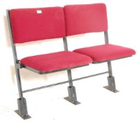 A set of two vintage retro 20th Century folding cinema / theatre chairs having red upholstered block