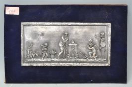 A vintage resin plaque decorated with a single female figure beside a fire with a good and bad