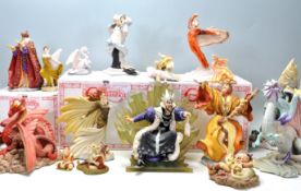A collection seventeen Hollandscraft 'Enchantica' figures with wizards, dragons, fairies to