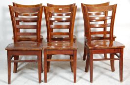 A matching set of seven cafe / pub rail back chairs having wide seat pads with bent wood