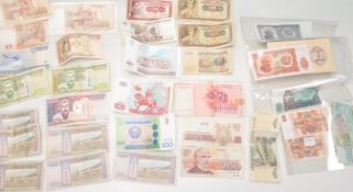 A collection of mostly Russian banknotes to include a selection of Russian Roubles of different ages