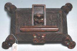 Wahaika New Zealand - A carved Maori tribal wooden ink stand having intricate carved decoration to