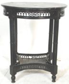 A 19th Century Victorian aesthetic movement black lacquered round occasional / side central table