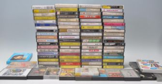 A collection of retro vintage music cassette tapes to include Dolly Parton, Rolling Stones, Blondie,