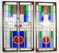 A group of three 20th Century leaded stained glass panelled doors each being set with green, blue