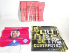 A stack of approx 30 2018 Boomtown Music Festival posters.