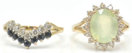 A 9ct gold hallmarked cluster ring. The yellow facet cut stone within a halo of white stones.