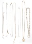 A group of seven silver ladies necklace chains to include a box link example having a spring ring