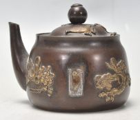 A Antique Chinese miniature brass inkwell in the form of a teapot having applied barss decoration