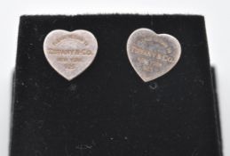 A pair of sterling silver Tiffany & Co style heart shaped earrings. The earrings have PLEASE