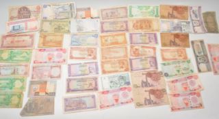 A collection of 20th Century Middle Eastern bank notes to include Saudi Arabian Riyals, Jordan