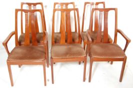 A set of six vintage retro Nathan teak wood framed dining chairs having pierced back rests with
