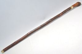 A vintage 20th Century bamboo sword stick / walking stick cane having a root knot ball knob to