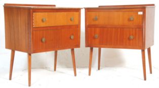A matching pair of retro mid 20th Century teak chest of drawers raised on teak tapering supports.