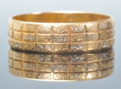 A stamped 916 22ct gold band ring having engraved geometric decoration. Weight 3.1g. Size O.