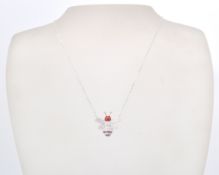 A stamped sterling silver and CZ pendant necklace in the form of a bee coloured in white and red