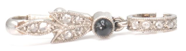 An early 20th century French platinum, onyx and diamond set dog clip baille - bale. The bale with