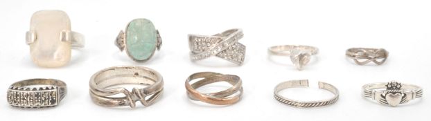 A group of ten silver ladies rings to include one set with a stone carved scarab beetle,